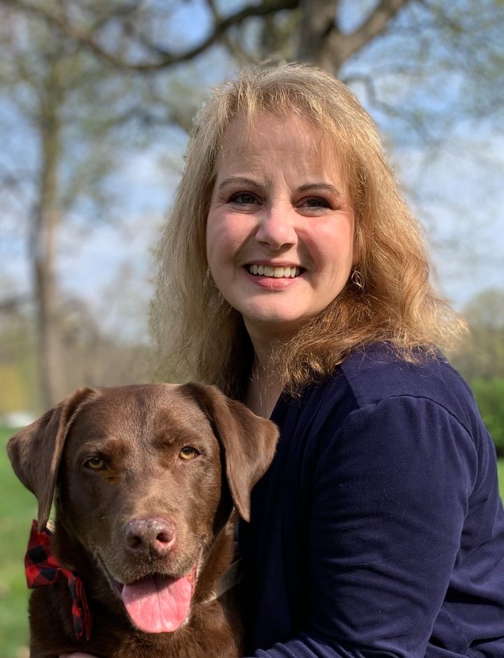 Tawney Roddy with her chocolate Labrador